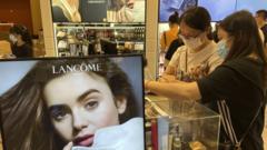 Tourists spend money at a lancome cosmetics store in Haikou, South China's Hainan Province, 2 September 2021.