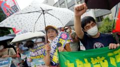 Protesters shout slogans and hold banners reading 'Don't discharge contaminated water into the sea!' during a rally in front of the Prime Minister's official residence as Prime Minister Fumio Kishida was holding a ministerial meeting about the release of treated water from the crippled Fukushima nuclear power plant into the sea, in Tokyo, Japan, 22 August 2023.