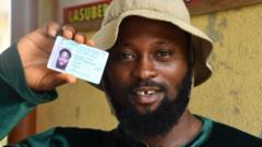 A man showing his voter card