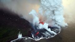 Aerial view taken 06 April 2007 near Tremblet in the French oversea island of La Reunion, of lava coming from the Piton de la Fournaise volcano burning vegetation and pouring into the Indian Ocean.