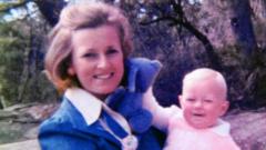 Lynette Dawson holds one of her baby daughters