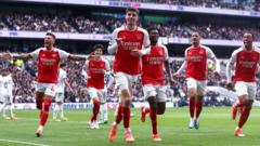 Premier League: Arsenal hold on to beat Spurs and go four points clear