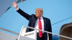 Donald Trump waves as he boars Air Force One prior to departing from Joint Base Andrews in Maryland, July 3, 2020
