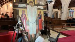 Work to restore 10ft Jesus painting under way