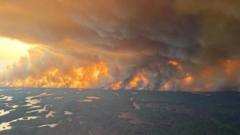 Thousands flee wildfire in Manitoba as 'out of control' blazes burn across Canada