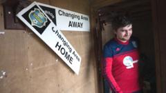 A player coming out of the dressing rooms at Garrison Field in the Isles of Scilly