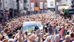 Thousands of Bonnie Tyler fans line the streets as coffin taken to Swansea home