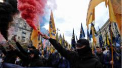 Members of the nationalist movements hold burning flares during the March of the Nation to the Day of Defender of Ukraine