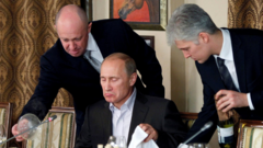 Yevgeny Prigozhin helping Vladimir Putin at a dinner table, 2011