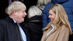 Boris Johnson and Carrie Symonds in March 2020 at Twickenham Stadium