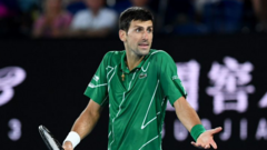 Djokovic shrugging his shoulders during the 2020 Australian Open