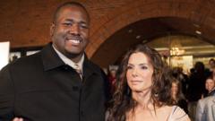 Actor Quinton Aaron and actress Sandra Bullock attend The Blind Side benefit premiere