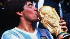 Diego Maradona kissing the World Cup after victory in 1986