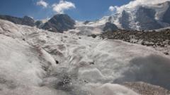 Meltwater flows on the ice of the Pers Glacier in front of Mount Piz Palue near the Alpine resort of Pontresina, Switzerland
