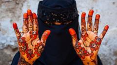 Muslim woman with henna on the hands and arms, Lamu County, Lamu, Kenya on March 2, 2011 in Lamu, Kenya.