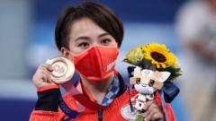 Bronze medalist Mai Murakami of Japan poses on the podium during the medal ceremony for the Women's Floor Exercise Final at Artistic Gymnastics events of the Tokyo 2020 Olympic Games at the Ariake Gymnastics Centre in Tokyo, Japan, 02 August 2021.