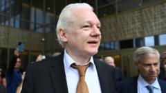 Julian Assange walks free after reaching plea deal in US court over leaking military secrets