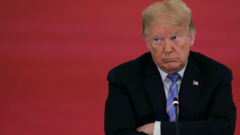FILE PHOTO: U.S. President Donald Trump listens during a meeting of the American Workforce Policy Advisory Board in the East Room at the White House in Washington, U.S., June 26, 2020.