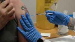 A woman being vaccinated with a booster jab in November in the UK