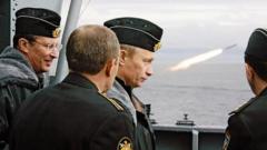 Pictured in 2005, Russian President Vladimir Putin watches the launch of a missile during military exercises aboard the "Pyotr Veliky" nuclear missile cruiser