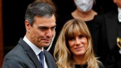 Prosecutors ask for halt to case against Spain PM's wife