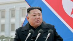 신형 초대형 다연장로켓 발사대 기념식에 참석한 김정은 국무위원장