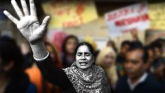 The victim's mother, Asha Devi, at protests