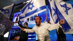 Supporters of Jewish Power party leader Itamar Ben-Gvir react following the release of exit polls in Israel's general election (1 November 2022)