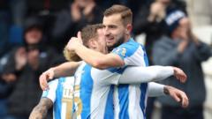 Championship: Ten-man Huddersfield in front against Leeds; Bristol City 0-1 Cardiff