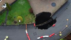 Homes evacuated after sinkhole opens on estate