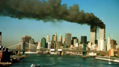 Smoke is seen at the towers of the World Trade Center shortly after being struck by a hijacked commercial aircraft, in New York, U.S., September 11, 2001.