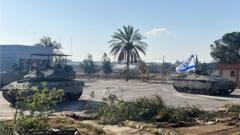 Israel says it controls key Gaza crossing as ceasefire talks to resume