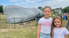 Kids enjoy show inside giant inflatable whale
