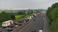 Three in hospital after crash causes 10-mile queue on M5
