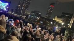 Moment crowds at River of Light sing Queen in the rain
