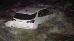 LA vehicle swept into ocean as rain hits fire-ravaged area