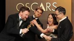 'It's a tie, I'm not joking' - unusual Oscars moment sees two films share award