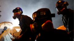 An anti-government protester holds a molotov cocktail during clashes with police outside Hong Kong Polytechnic University (PolyU) in Hong Kong, China, November 17, 2019.