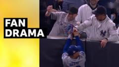 Yankees fan rips ball from fielder's glove