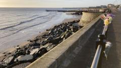 Tributes paid to woman who died on beach rocks