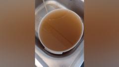 Apology over brown tap water smelling of petrol