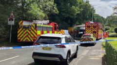 One dead and child injured as train hits car at level crossing