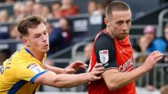 New boss Wilshere has 'aura' - Clark