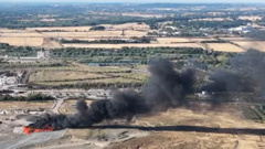 Firefighters tackle large blaze at landfill site