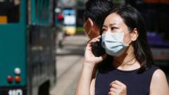 A woman wears a surgical mask following the coronavirus disease (COVID-19) outbreak, in Hong Kong, China July 17, 2020