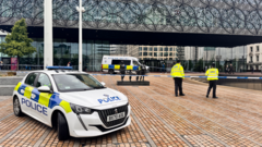 Arrests after two men stabbed outside library