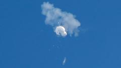 The suspected Chinese spy balloon (surveillance balloon) drifts to the ocean after being shot down off the coast in Surfside Beach, South Carolina, U.S. February 4, 2023.