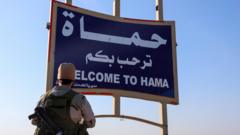 Syrian government forces and rebels battle outside key city of Hama