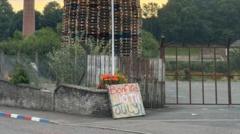 Bonfire with mosque replica placed on top set alight