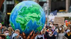 Protesters march to demand aggressive policies towards fighting climate change at a Fridays for Future march on September 24, 2021 in Dusseldorf, Germany.